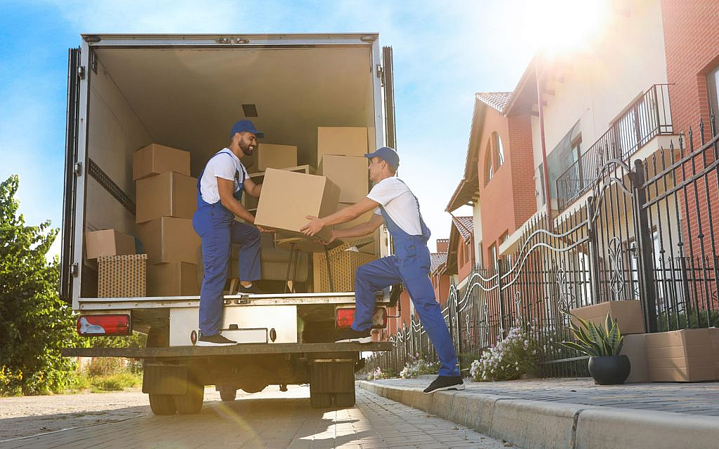 Movers carrying furniture